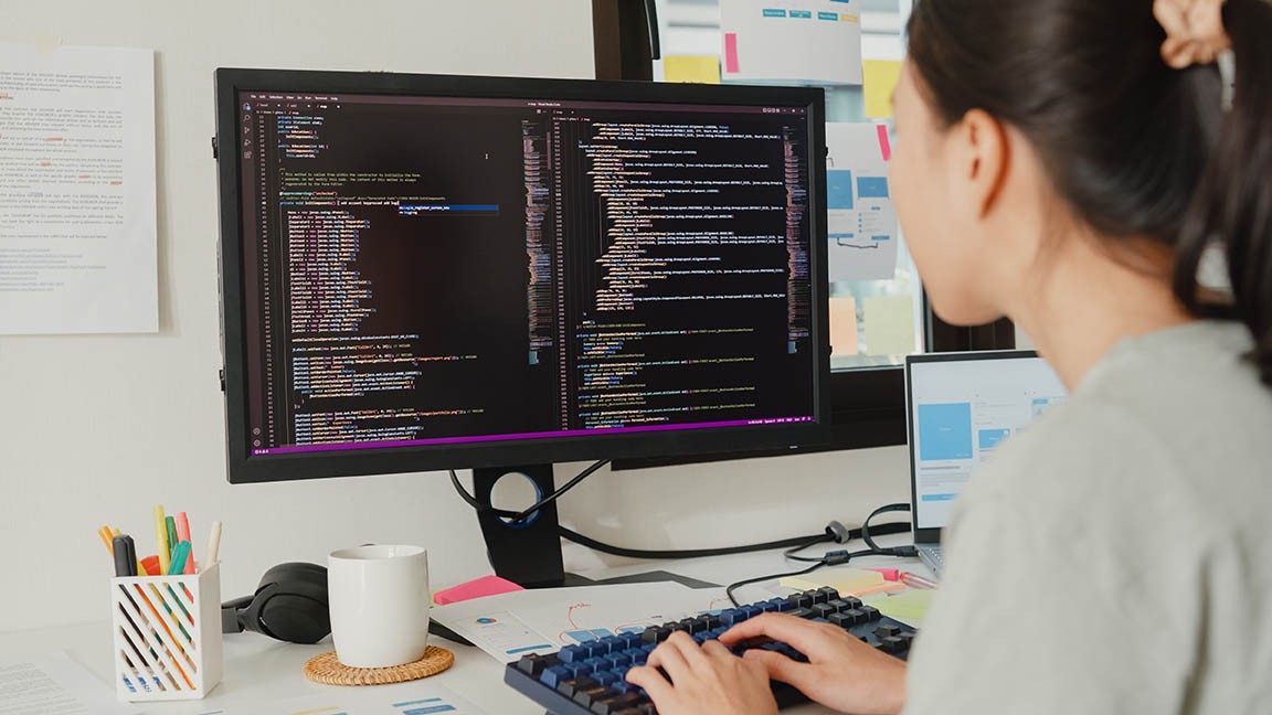 syoung-woman-working-as-software-developer-at-desk-2026-03-23-22-58-08-utc.jpg